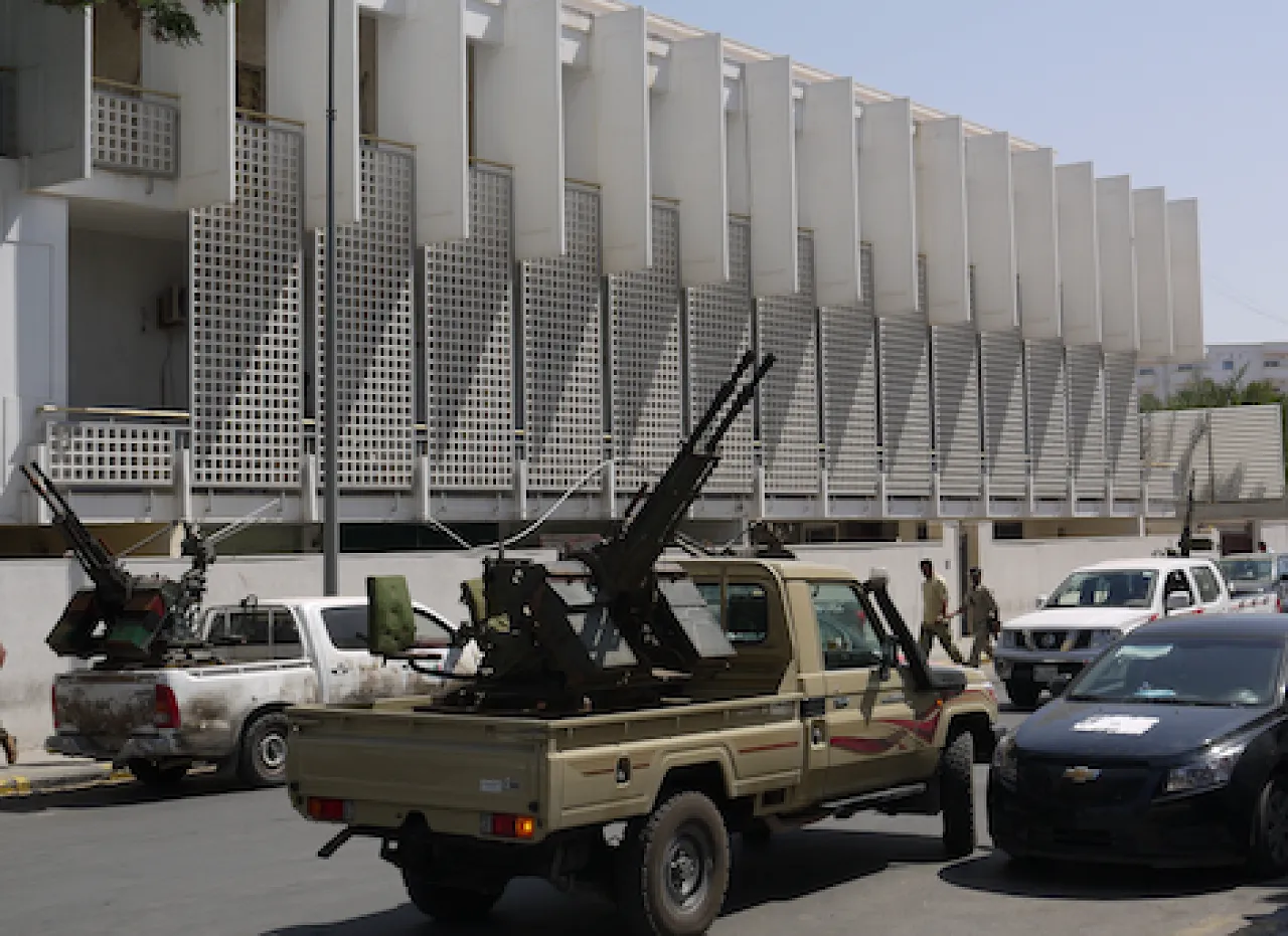 PrimeMinisterOfficeMilitia Weapons equal power. Militia vehicles parked outside the prime minister's office at a protest on 1 July. (Photo: George Grant)