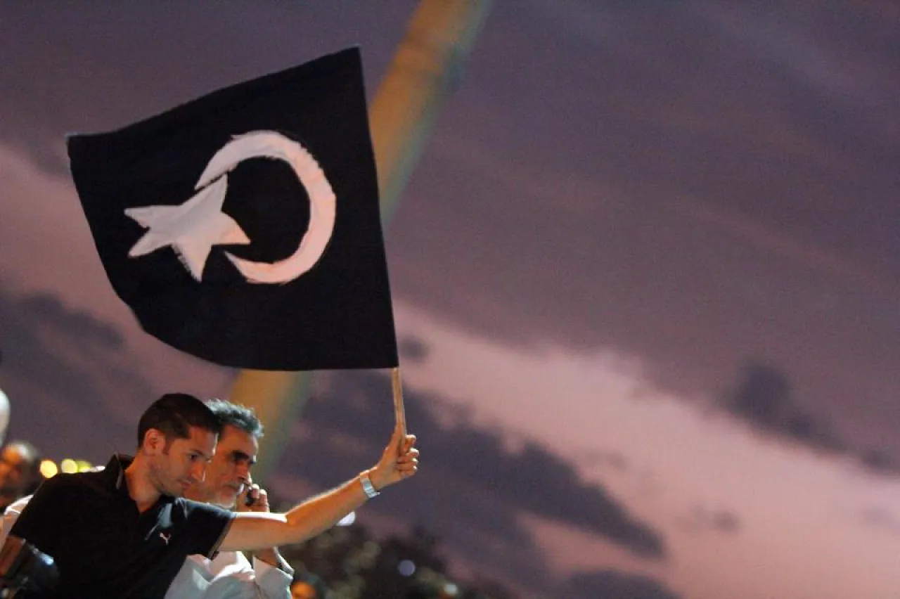 A protester waves the black flag of Cyrenaica during a pro-federalism rally in Benghazi on 2 November.