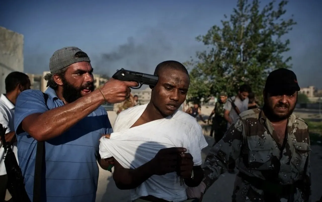 The late Rémi Ochlik's compelling picture of a suspected mercenary, after his capture