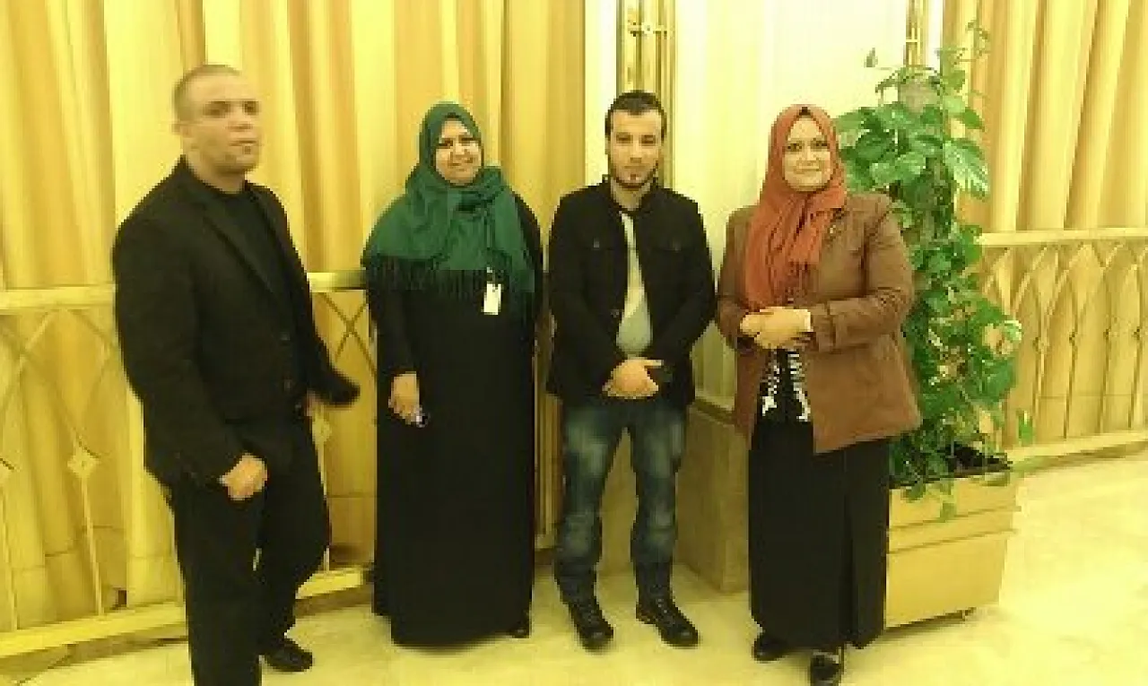 The two young men who allege that they are the true killers of Qaddafi and his son Moatassim, pose for photos with participants at the One Voice 2013 women's conference earlier this week (Photo: Issraa Murabit).