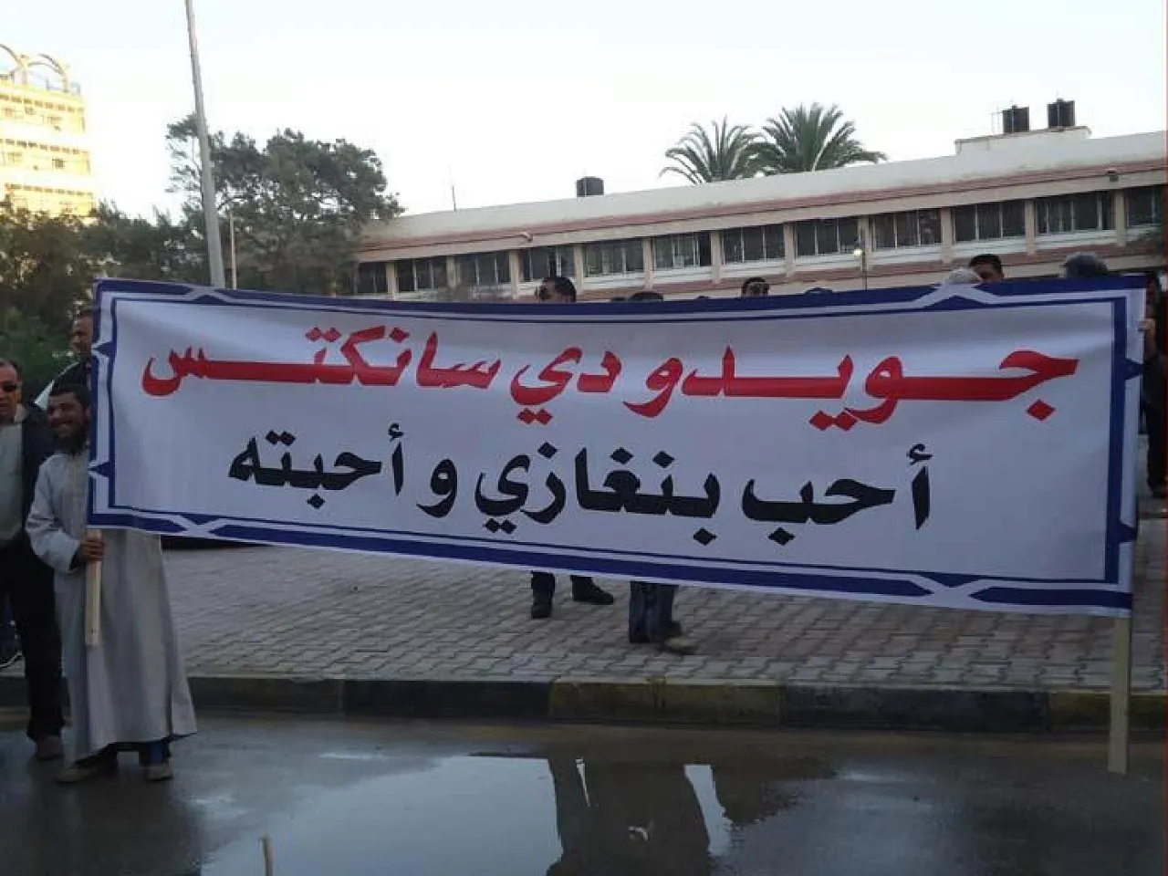 Bengahzi sanctis 1 Posters in Benghazi proclaim that "Guido di Sanctis loves Benghazi and it loves him"