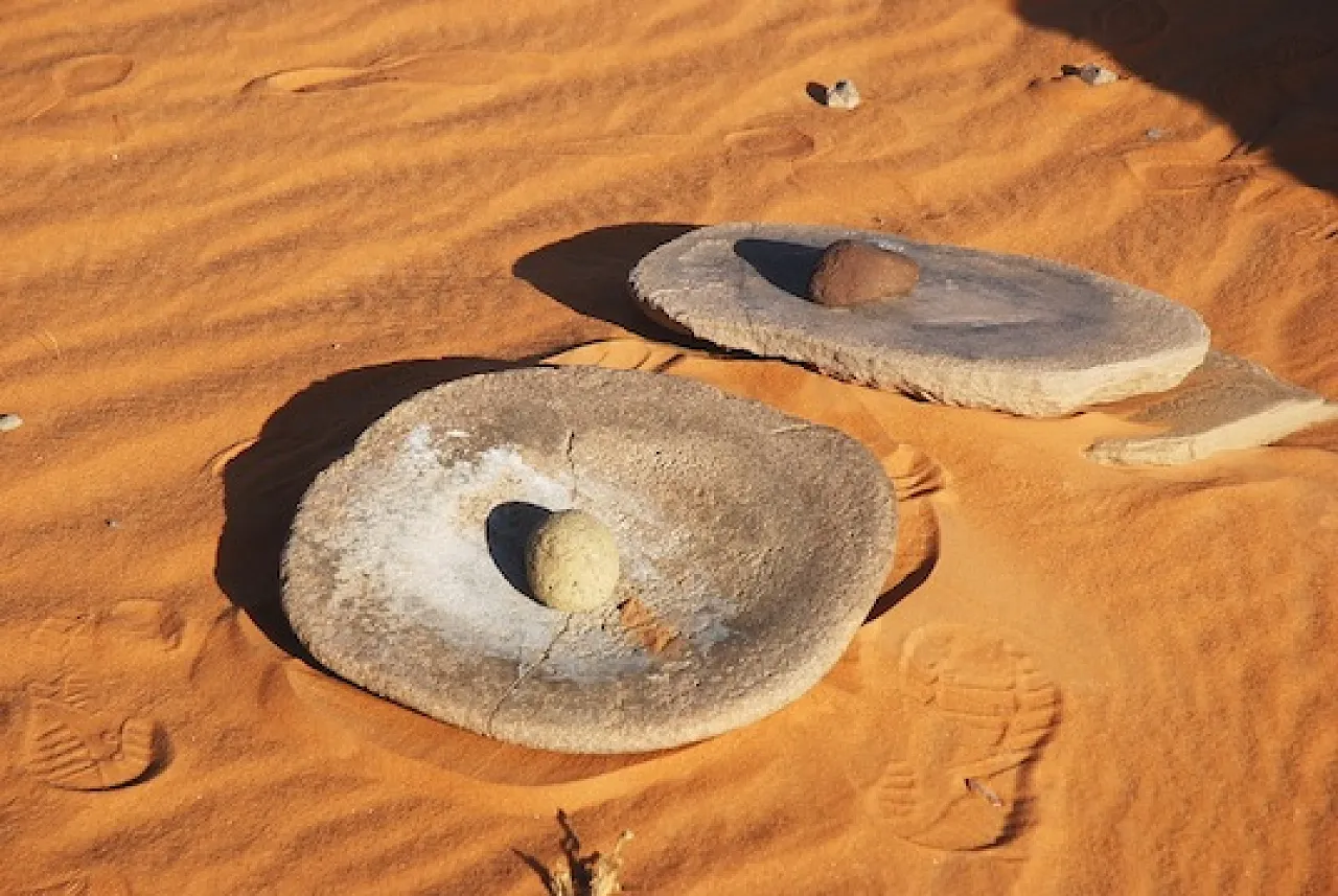 Ancient grinding stones. All these items lie unprotected on the surface of the desert in a remote area. These items will be picked up sooner or later by the frequent desert visitors.