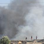 Tripoli fire fighters call for support to control warehouse blaze