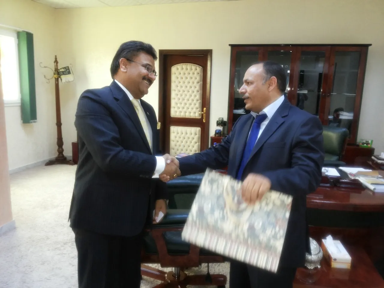 Agriculture Minister Agriculture Minister Saleh Hamed Mahjoub shakes hands with the Indian Ambassador