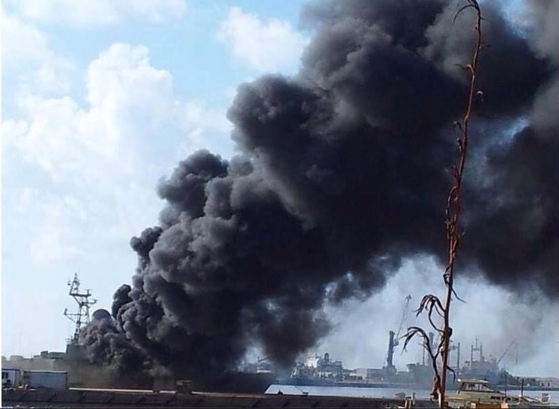 Navy ship on fire as clashes rage around Benghazi port