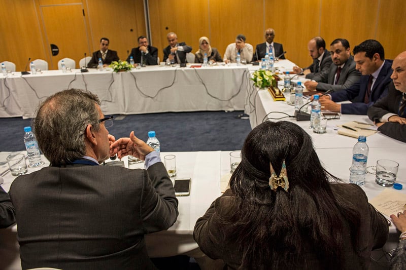 Bernardino Leon (back to camera) explains a point during one of the separate dialogue sessions this evening (Photo: UNSMIL)
