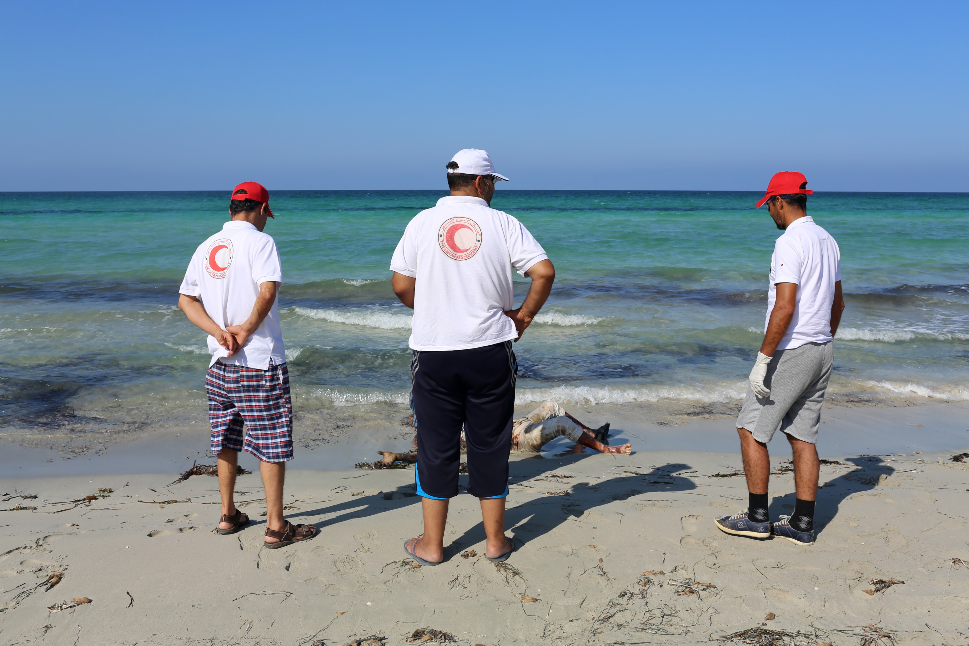 Scores of migrant bodies washed back to Libya