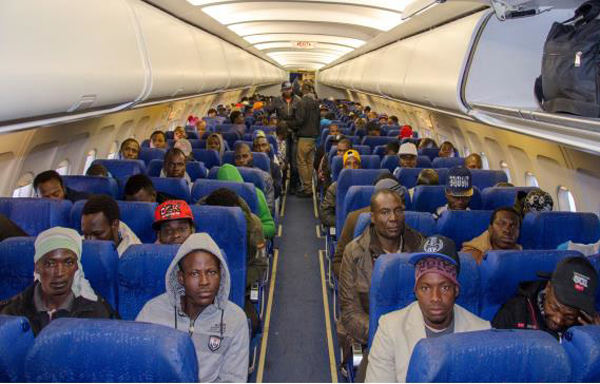 Despairing migrants flown home
