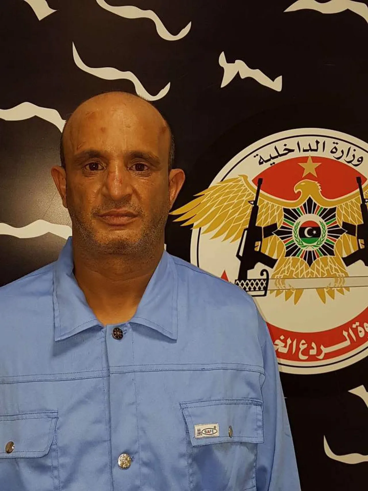 The alleged 'fuel smuggling boss, Ben Khalifa held by Rada (Photo: Rada).