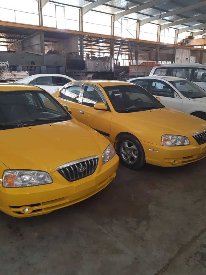Tripoli starts to paint its taxis yellow