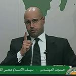 Saif al-Islam Qaddafi buried in Bani Walid next to his brother – thousands attend funeral as supporters of former regime display old green flag